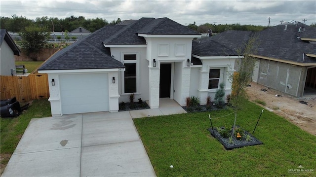 view of front of home with a garage and a front yard