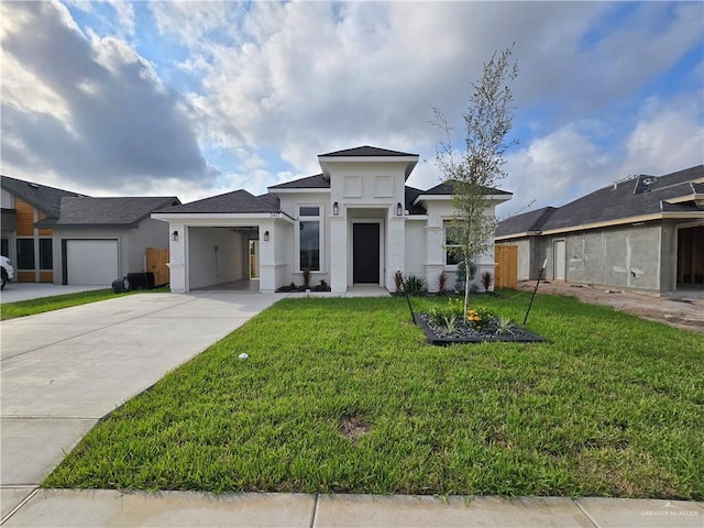 prairie-style house featuring a garage and a front yard