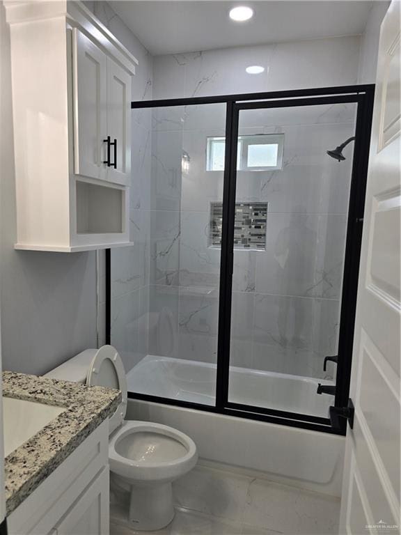 full bathroom with vanity, toilet, and enclosed tub / shower combo