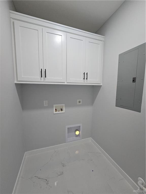 clothes washing area with electric panel, hookup for a washing machine, cabinets, and hookup for an electric dryer