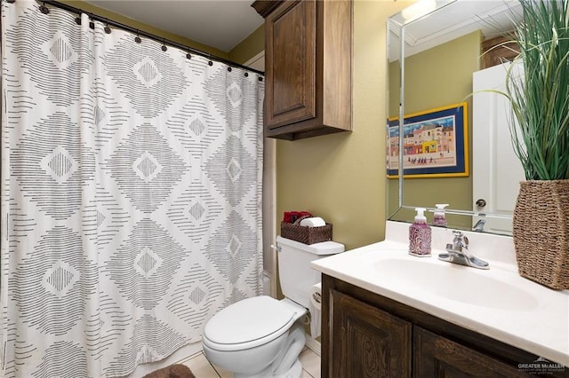 bathroom with tile patterned floors, vanity, and toilet