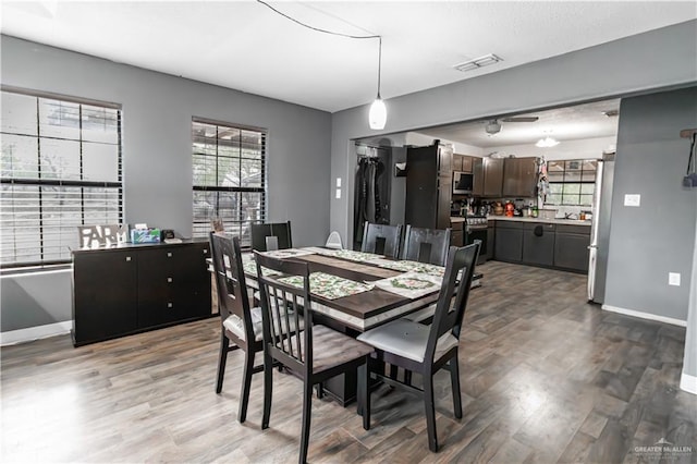 dining area featuring wood-type flooring