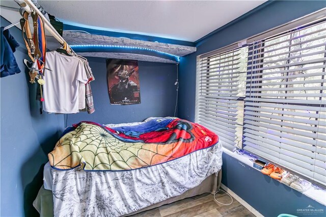 bedroom featuring hardwood / wood-style flooring