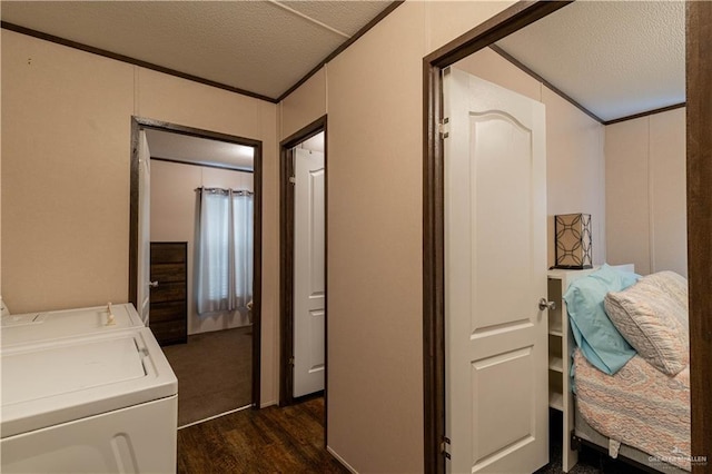 interior space with separate washer and dryer, laundry area, ornamental molding, and a textured ceiling