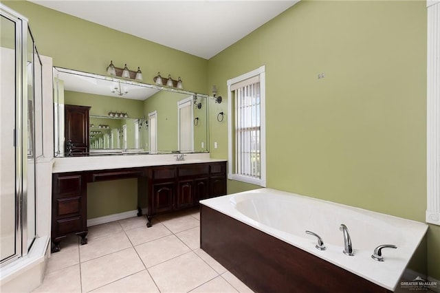 bathroom with tile patterned flooring, vanity, and independent shower and bath