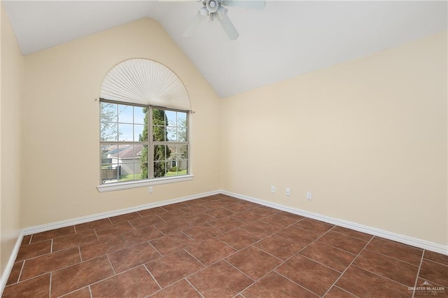 tiled empty room with vaulted ceiling and ceiling fan