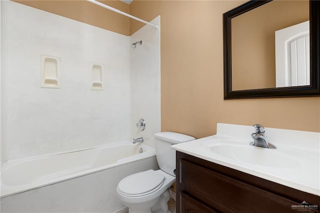 full bathroom featuring shower / bathing tub combination, vanity, and toilet