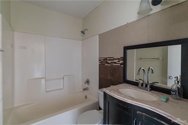 full bathroom featuring vanity, shower / bath combination, tile walls, and toilet