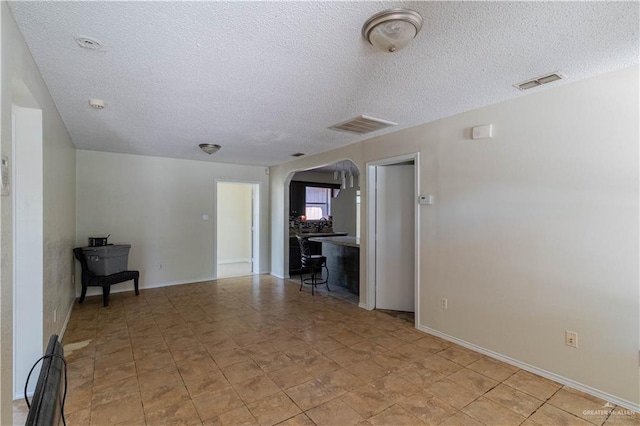 interior space featuring a textured ceiling