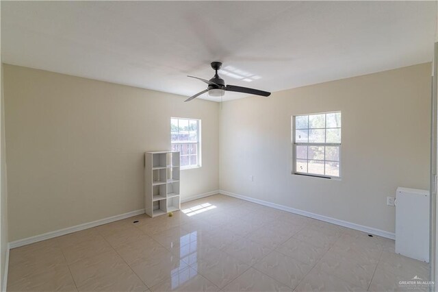 empty room featuring ceiling fan