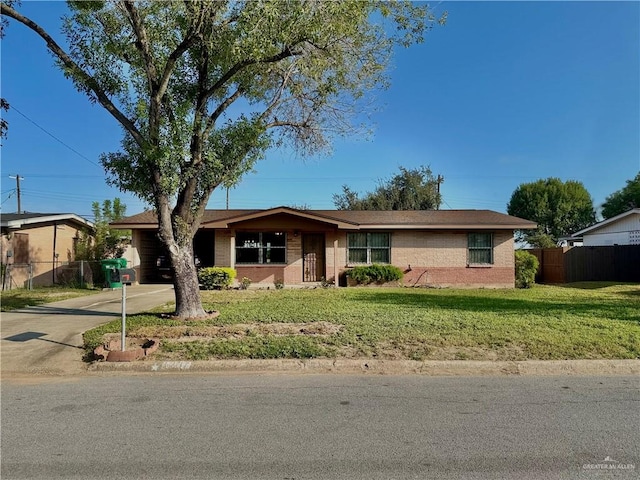 ranch-style home with a front lawn