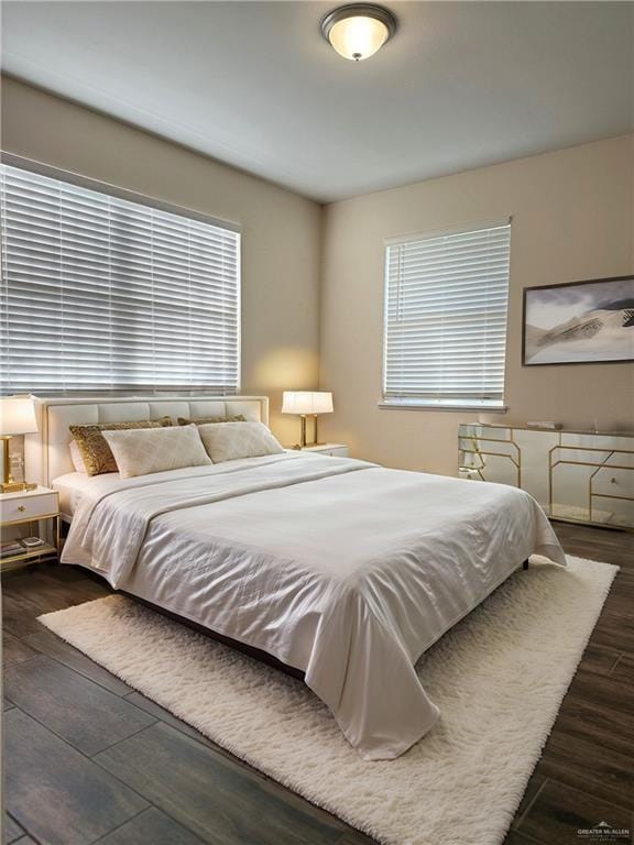 bedroom featuring dark wood-type flooring