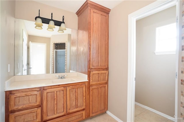 bathroom with tile patterned floors, vanity, and walk in shower