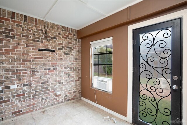 interior space with cooling unit and brick wall