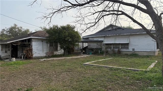 rear view of house with a lawn