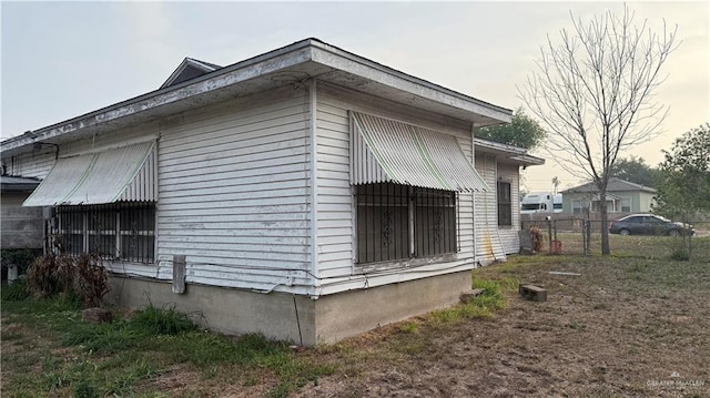 view of side of property with fence