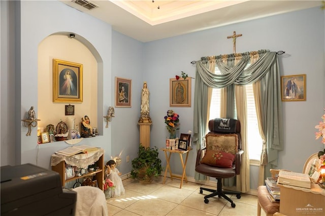 sitting room featuring light tile patterned floors