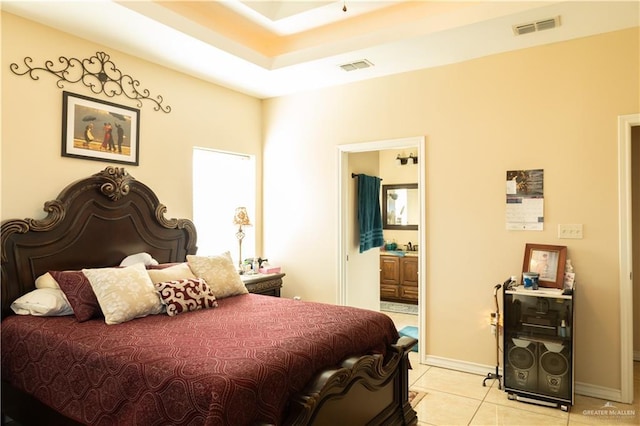 tiled bedroom featuring ensuite bathroom