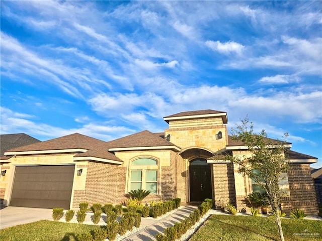 mediterranean / spanish-style house with a front lawn and a garage