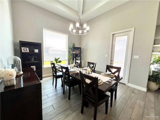 dining space featuring a notable chandelier