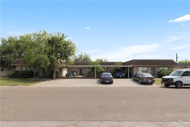 ranch-style house featuring a carport