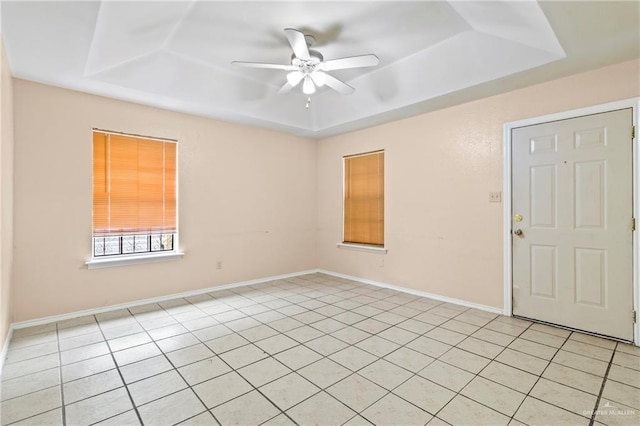 2117 S 30 1/2 St, Mcallen, TX 78503 - unfurnished room with a raised ceiling, ceiling fan, and light tile patterned floors