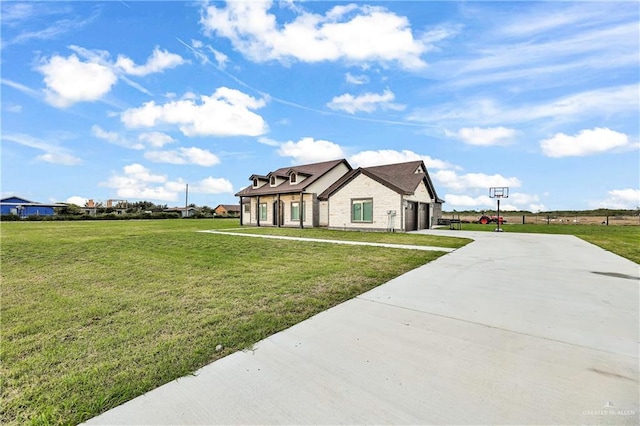 view of front of house with a garage and a front lawn