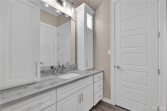 bathroom featuring vanity and wood-type flooring