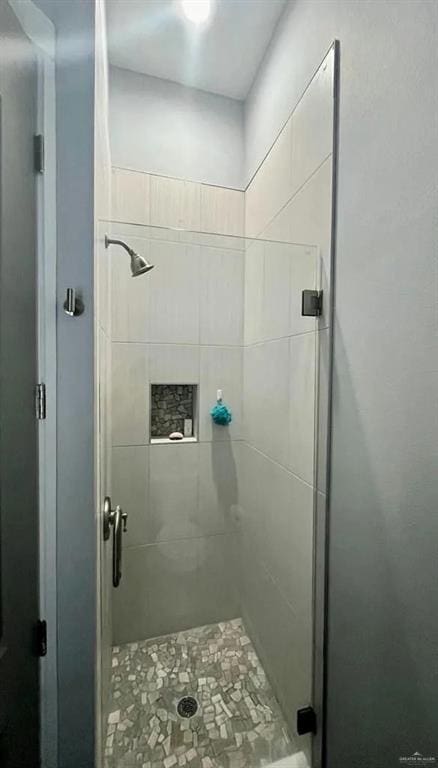 full bath with a shower stall