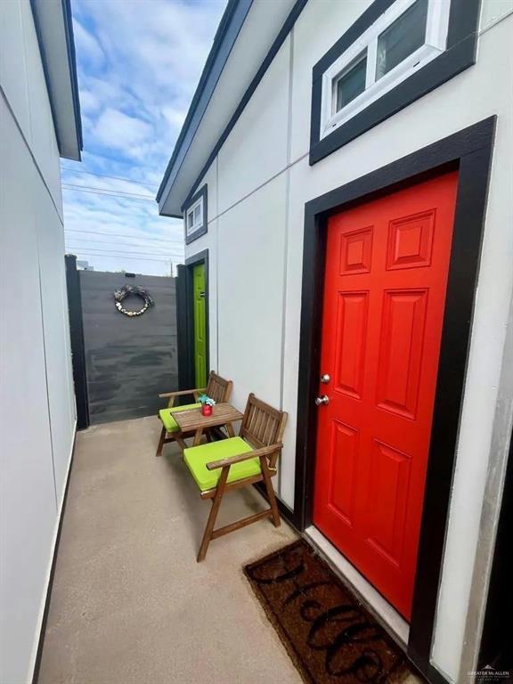 entrance to property with stucco siding