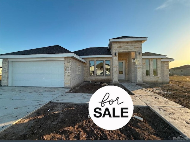 view of front of property with a garage