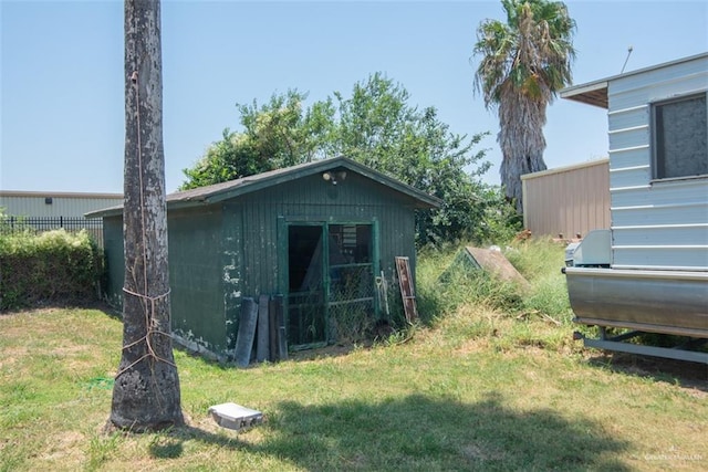 view of outbuilding with a lawn