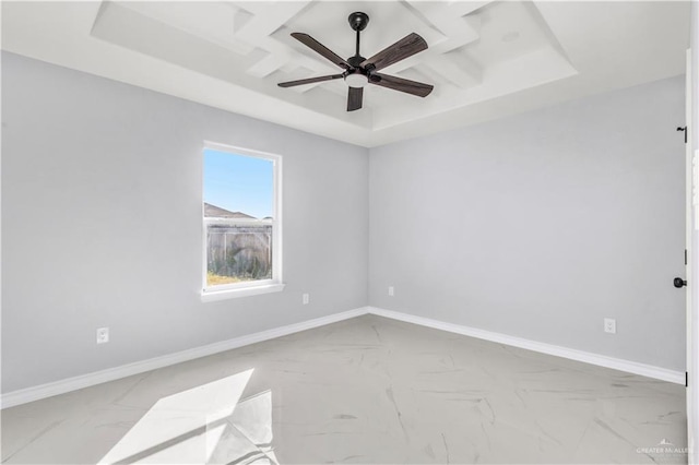 unfurnished room with a tray ceiling and ceiling fan