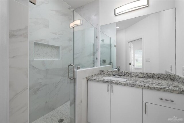 901 E Yuma Ave Unit 606, Mcallen, TX 78503 - bathroom with vanity and a marble finish shower