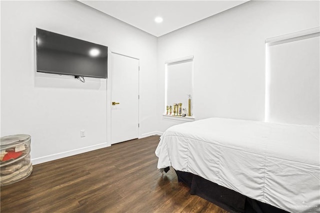 bedroom featuring dark wood-type flooring