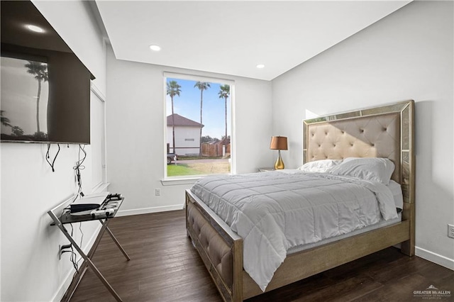 bedroom with dark wood-type flooring