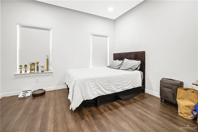 bedroom featuring dark hardwood / wood-style flooring