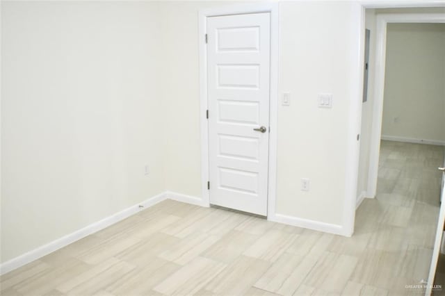 empty room with light hardwood / wood-style floors