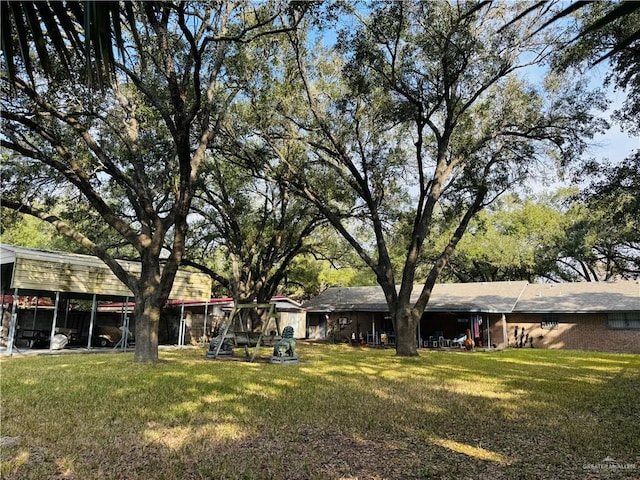 view of yard with a carport