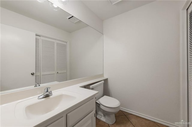 2702 Lazy Lake Dr, Harlingen, TX 78550 - bathroom featuring a closet, tile patterned floors, and vanity