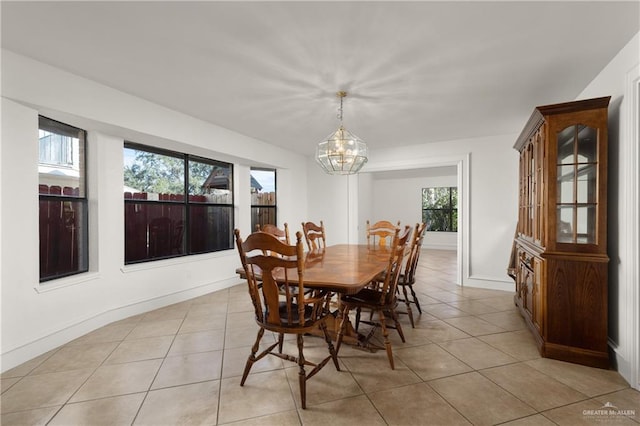 2702 Lazy Lake Dr, Harlingen, TX 78550 - dining area with a chandelier and light tile patterned flooring