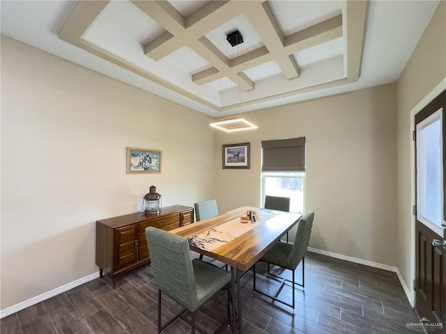 dining space with beam ceiling and coffered ceiling