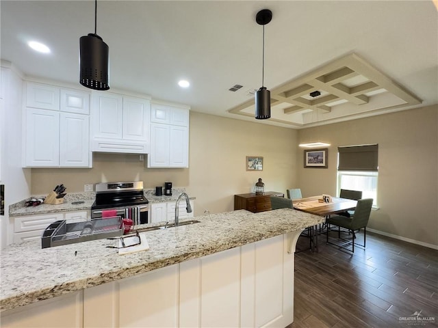 kitchen with stainless steel range with electric stovetop, coffered ceiling, white cabinets, hanging light fixtures, and light stone counters