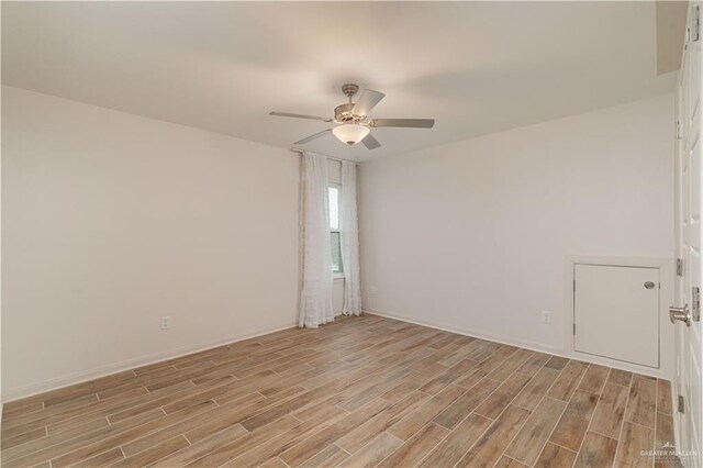 14451 Chalk Ridge Dr, Mcallen, TX 78504 - unfurnished room with light wood-style floors, a ceiling fan, and baseboards