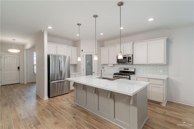 14451 Chalk Ridge Dr, Mcallen, TX 78504 - kitchen featuring stainless steel appliances, a sink, baseboards, decorative backsplash, and ornamental molding