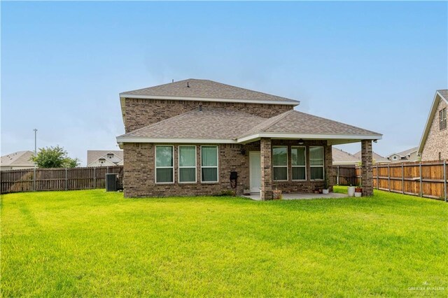 14451 Chalk Ridge Dr, Mcallen, TX 78504 - back of house featuring a patio area, central AC unit, a shingled roof, and brick siding