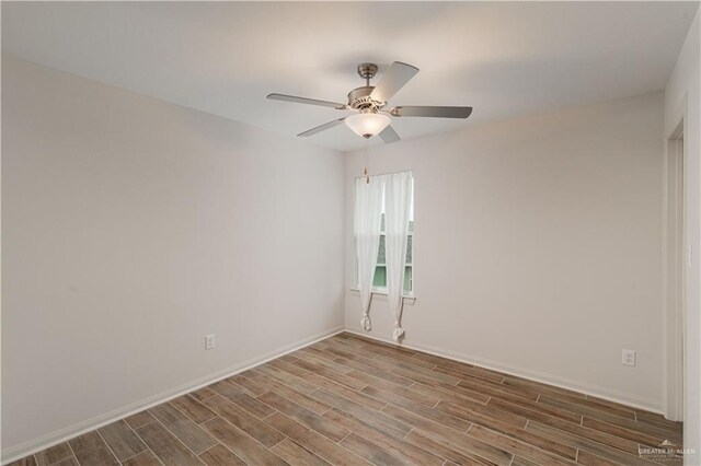 14451 Chalk Ridge Dr, Mcallen, TX 78504 - empty room with wood finished floors, ceiling fan, and baseboards