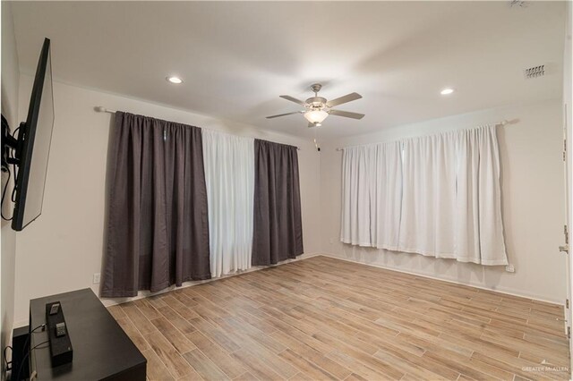 14451 Chalk Ridge Dr, Mcallen, TX 78504 - spare room featuring a ceiling fan, light wood-style flooring, and recessed lighting