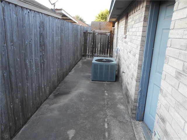 view of side of home with central AC unit