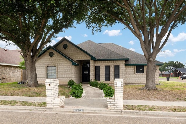 6800 N 35th St, Mcallen, TX 78504 - view of front of home featuring a shingled roof and brick siding